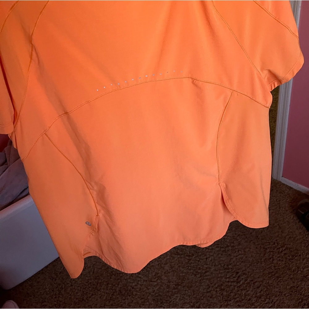 Orange Lululemon workout tops a size 12